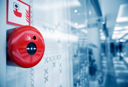 Fire Alarm on the Wall of an Office Building